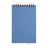 Blue spiral-bound notebook on a white background