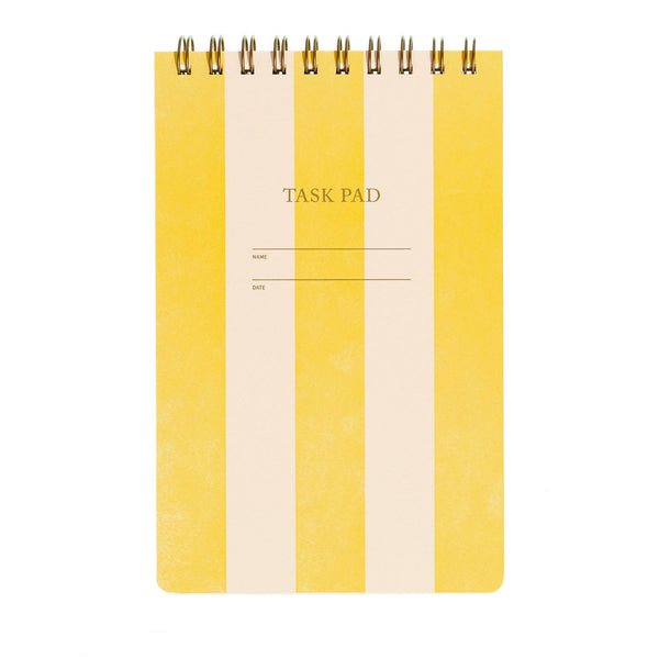 Yellow and beige task pad with spiral binding on a white background