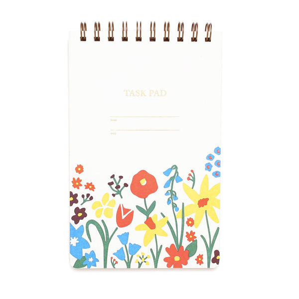 Notebook with colorful floral design on a white background