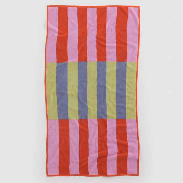 Colorful striped towel with red, pink, green, and blue stripes on a white background