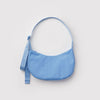Light blue nylon crescent shaped handbag on a light grey background.