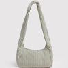 Green and white striped handbag on a light gray background