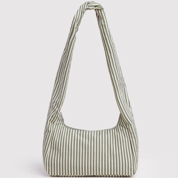 Green and white striped handbag on a light gray background