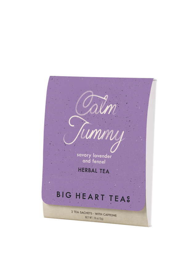 Purple package of Big Heart Teas Calm Tummy herbal tea on a white background