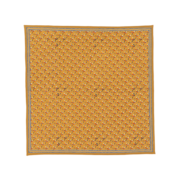 Yellow patterned bandana on a white background