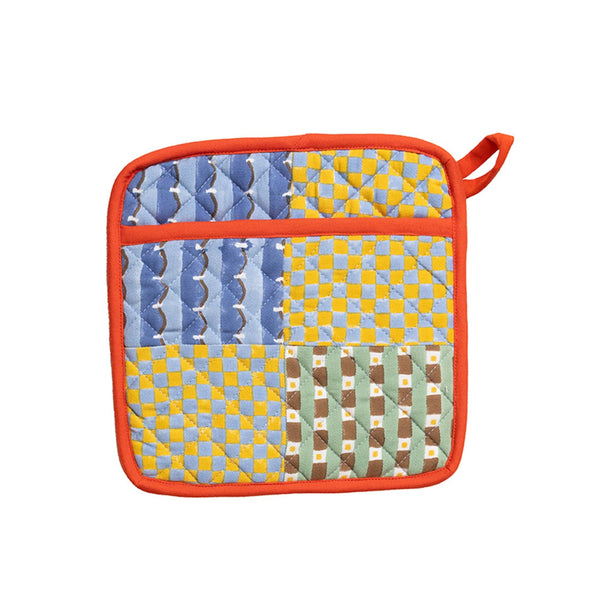 Multicolored quilted pot holder with orange border on a white background