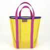 Yellow mesh tote bag with purple handles and trim on a white background