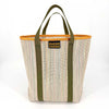Woven tote bag with green handles and orange trim on a white background