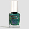 Green glittery nail polish bottle with 'cirque colors' branding on a light gray background