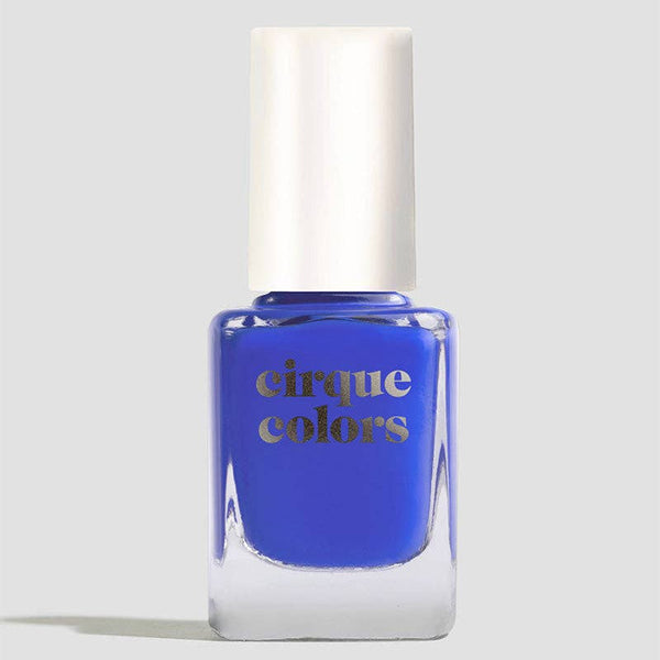 Blue nail polish bottle with 'cirque colors' branding on a light gray background