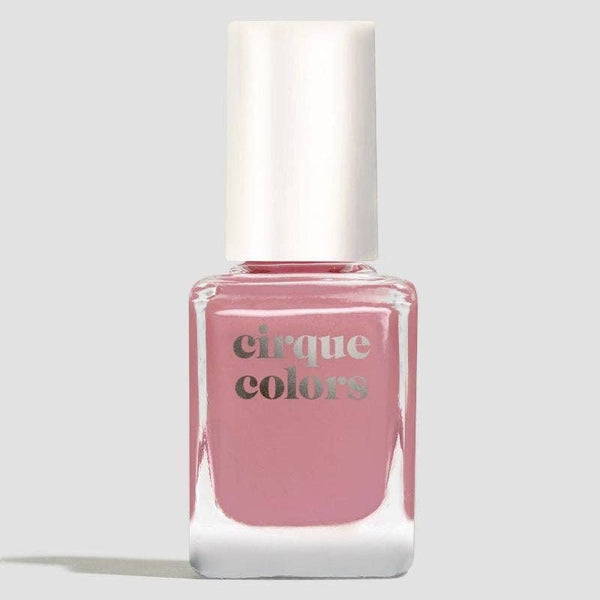 Pink nail polish bottle with 'cirque colors' branding on a light gray background