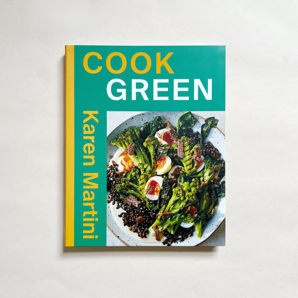 'Cook Green' by Karen Martini cookbook on neutral background.