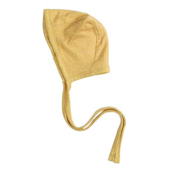 Yellow and white dot print baby bonnet with a strap on a white background