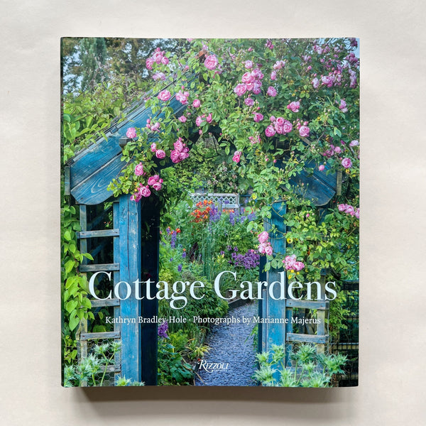 Book cover of 'Cottage Gardens' with a garden scene and blue structure.