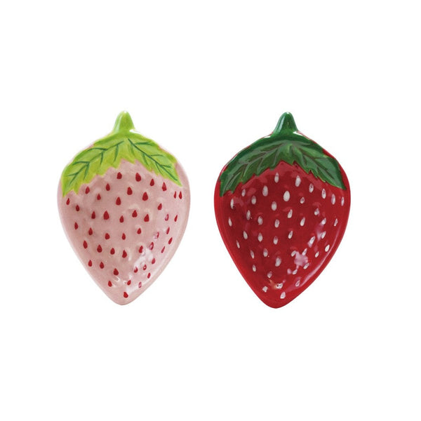 Two strawberry-shaped mini ceramic dishes on a white background