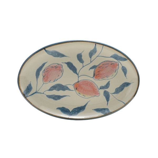 Ceramic platter with blue and orange lemon design on a white background