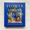 Book titled 'Flower House Mexico' with floral design images on a blue cover.