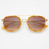 Gold-framed sunglasses with brown lenses on a white background