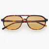 Sunglasses with tortoiseshell frame and gold lenses on a white background