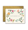 Greeting card with floral design and 'Happy Mother's Day' text, accompanied by a gold envelope on a white background.