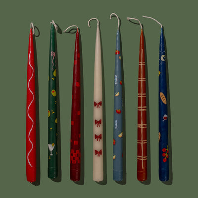 Set of colorful candles with various designs on a transparent background