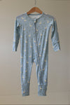 Blue baby onesie with geese pattern on a hanger against a beige wall.