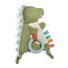Green dinosaur-shaped crinkle toy with a teether ring on a white background