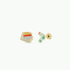 Two small book and worm earrings on a white background