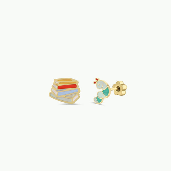 Two small book and worm earrings on a white background