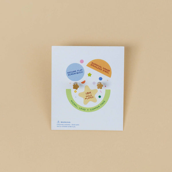 JaxKelly kid's earrings packaging on a beige background