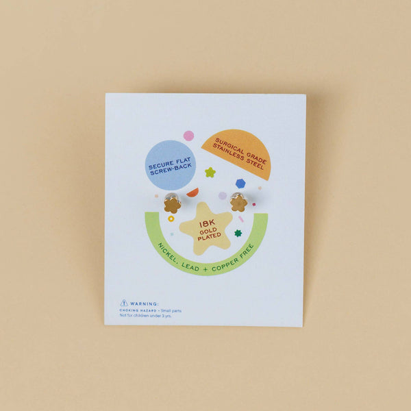 JaxKelly kid's earrings packaging on a beige background