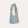 Blue and white checkered bag on a light gray background