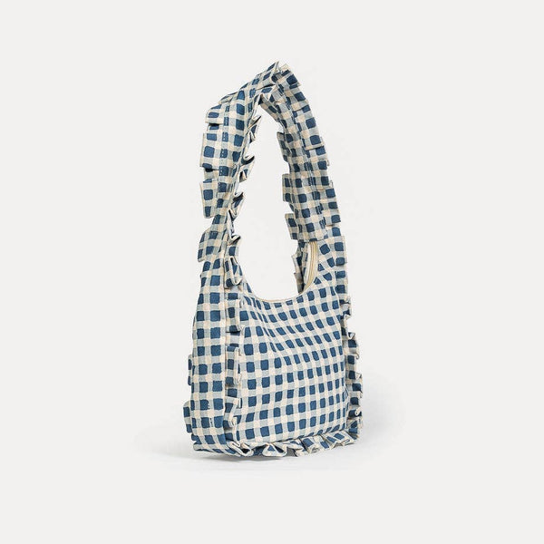 Blue and white checkered bag on a light gray background