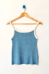 Blue and white striped knit cami on a wood hanger against a white background.