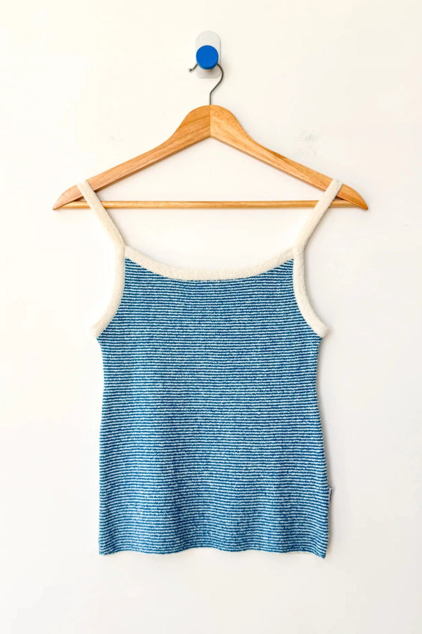 Blue and white striped knit cami on a wood hanger against a white background.