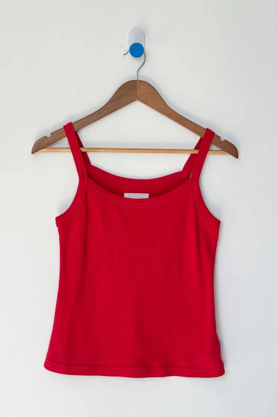 Red tank top on a wooden hanger against a white background