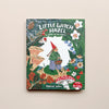An illustrated children's book "Little Witch Hazel: A Year in the Forest" by Phoebe Wahl. The cover features Little Witch Hazel surrounded by a colorful forest scene. The book sits on a neutral background.