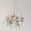 A group of ceramic and wood bead crystal ball suncatchers in a variety of colors and styles. 