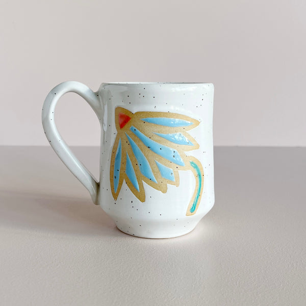 White ceramic mug with blue coneflower design.