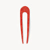 Red hairpin on a white background
