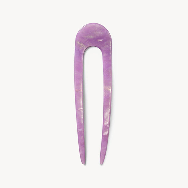 Purple hairpin on a white background