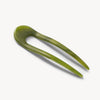 Green hairpin on a white background