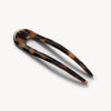 Brown and tan tonal checkered hair pin on a white background