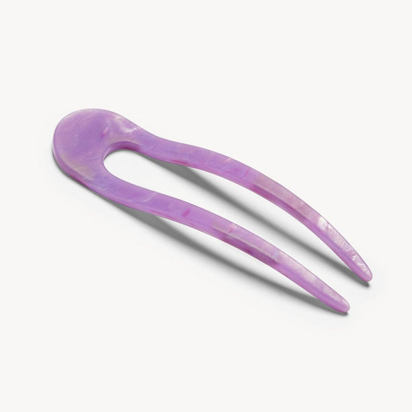 Purple hairpin on a white background