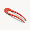 Red hairpin with marbled design on a white background