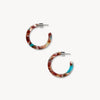 Multicolored hoop earrings on a white background