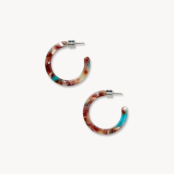 Multicolored hoop earrings on a white background