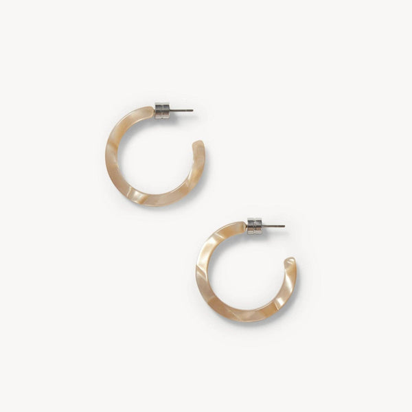 Pair of iridescent tan hoop earrings on a white background