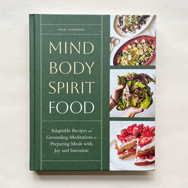 'Mind Body Spirit Food' cookbook cover on a beige background.