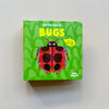 My First Pop-Up Bugs by Nelly Edwards hardcover kids book with a bright green cover featuring a ladybug illustration on a neutral background.